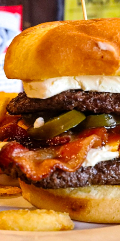 Burger with cheese, jalapenos, bacon for lunch or dinner from The Bears Den.